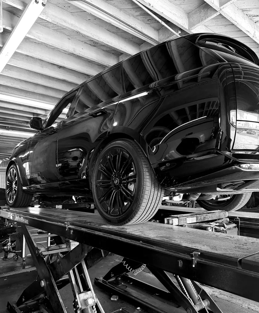 Range Rover on a John Bean alignment rack at ATS Auto Repair