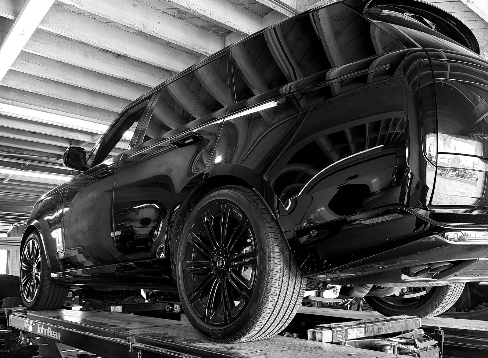 Range Rover on a John Bean alignment rack at ATS Auto Repair